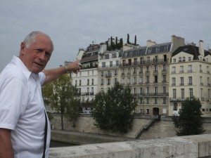 Bernie, pointing to our dream, pent-house apartment on Ile St. Louis