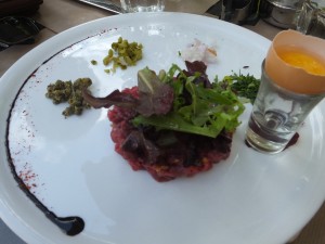 Bernie's steak tartar with all the fresh herbs and a raw egg ready to be mixed together.  It also had hazel nuts in it!  One of the best he's ever had.