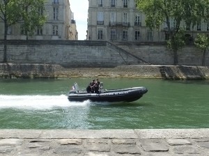 The police boat zipping down the water.