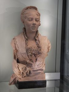 This bust was done in terra cotta. Notice the exquisitely crafted lace collar ruffle.