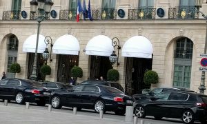 Main entrance to the Ritz characterized by rows of expensive cars