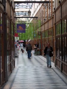 This is one of the ancient shopping arcades or passages in Paris called the Passage de Panoramic