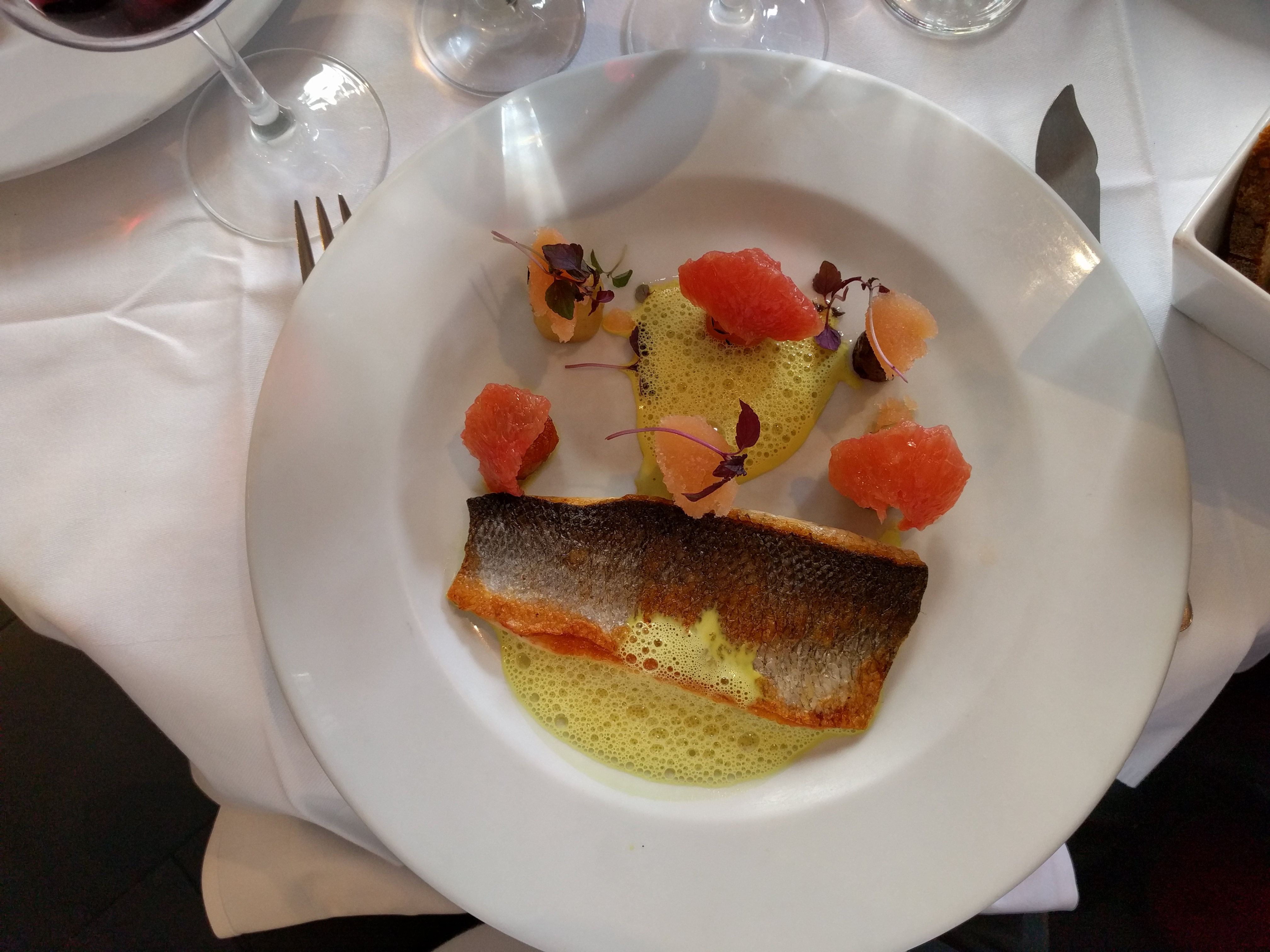 A main course of sea bass with carrots and grapefruit