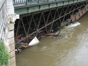 Large logs and other debris are all along the banks